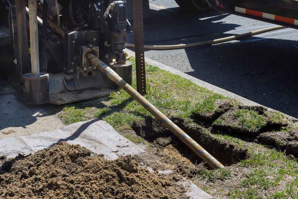 technician working with trenchless equipment